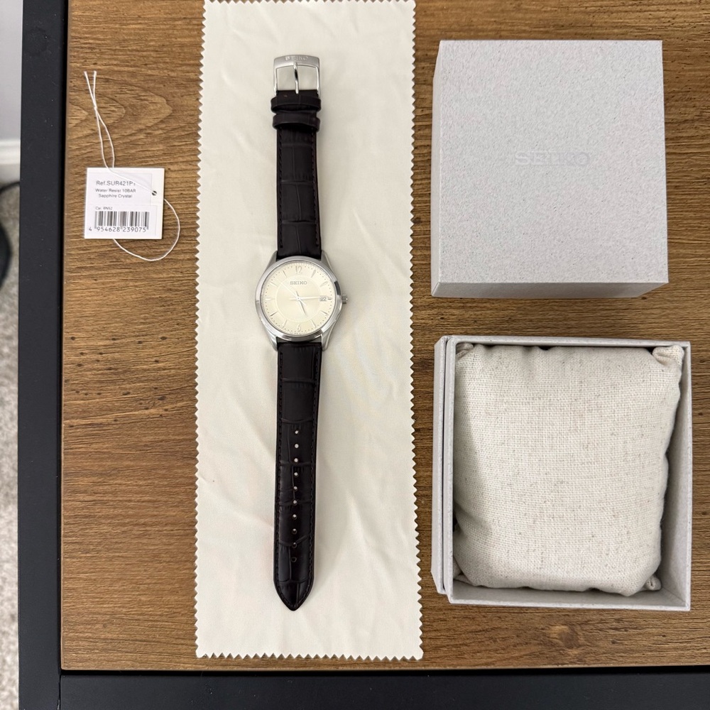 Seiko Noble Quartz Mens Watch.  Antique white dial, dark brown strap.